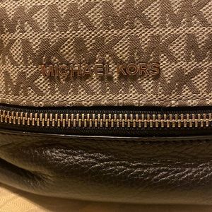 MICHAEL KORS BACKPACK tan color with black. Used